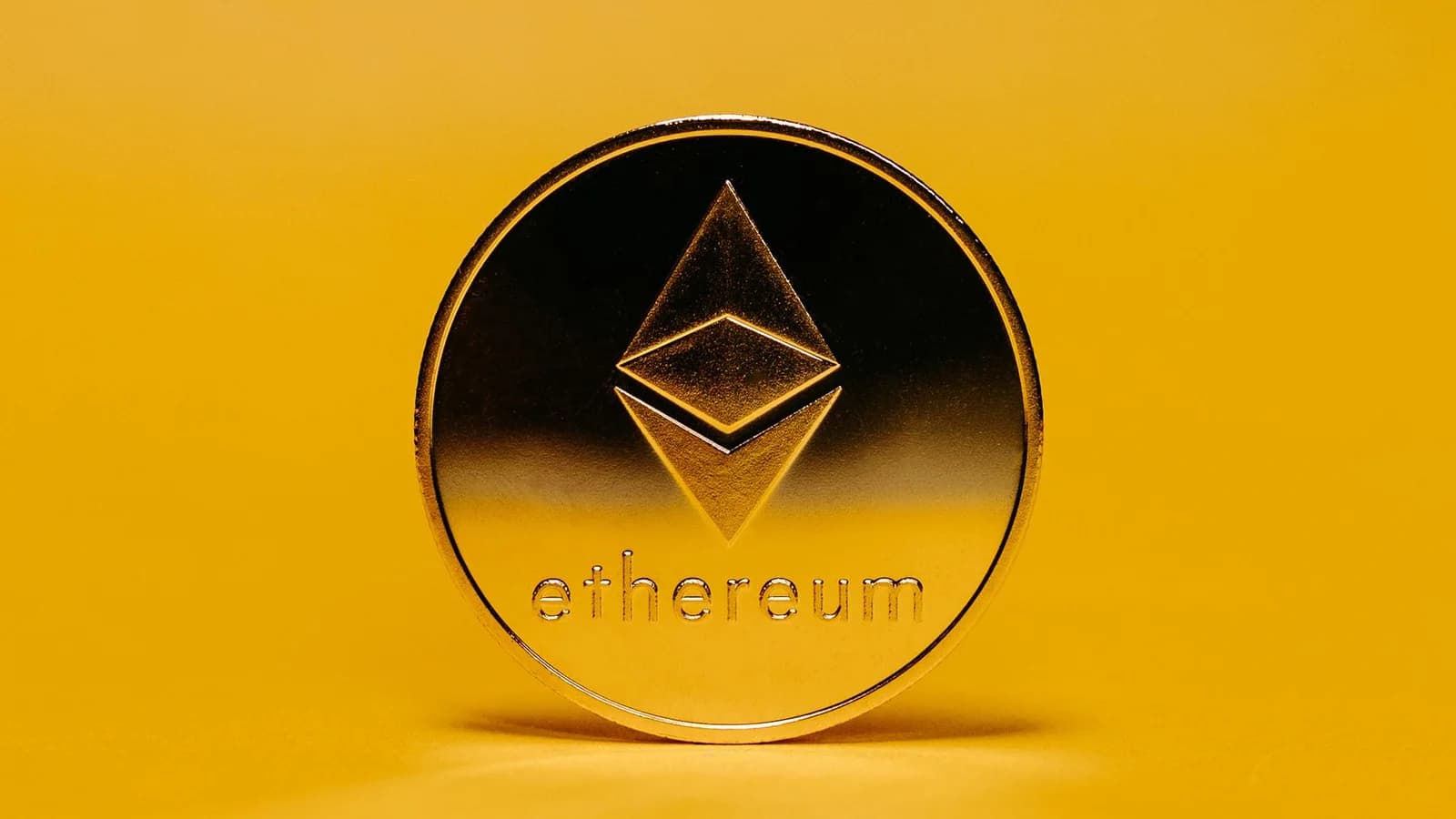 Ethereum coin on a yellow background