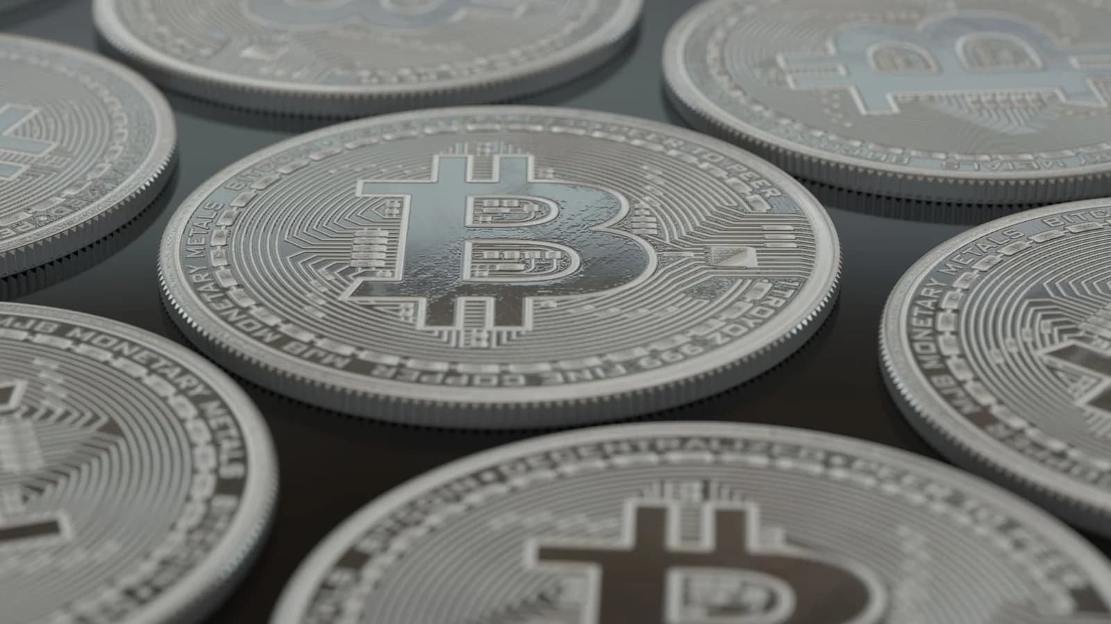Close-up of silver Bitcoin coins
