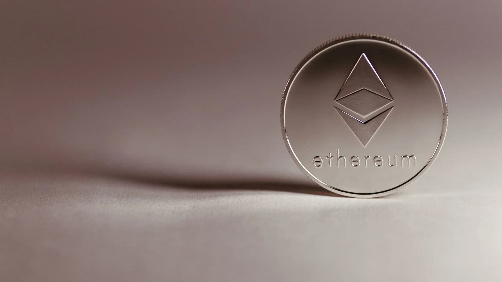 Close-up of a silver Ethereum coin