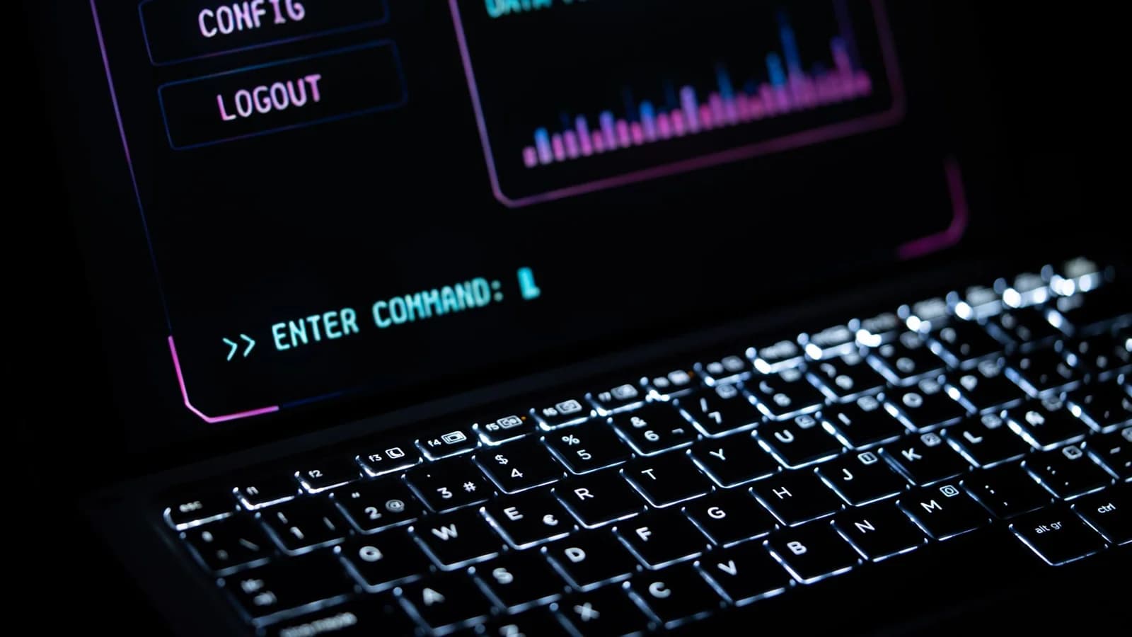 Close-up of a glowing laptop keypad with digital interface, representing futuristic technology.